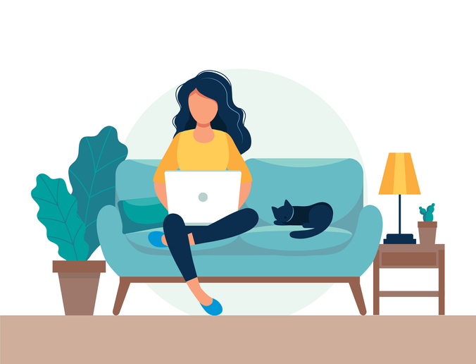 girl sitting on couch with laptop and cat